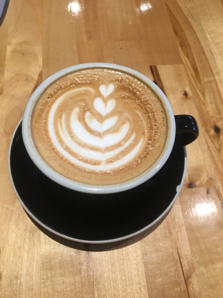 A beautiful cup of coffee with latte art. Feature image in caffeine detox post. 
