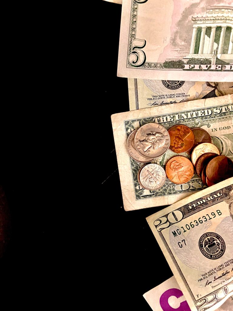Black background with money lined up along the right screen of the picture.