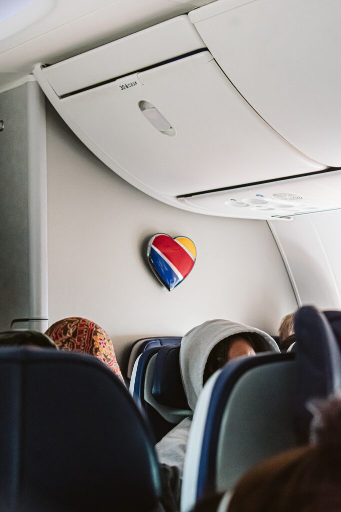 A Southwest flight cabin with a heart with the Southwest logo on it.