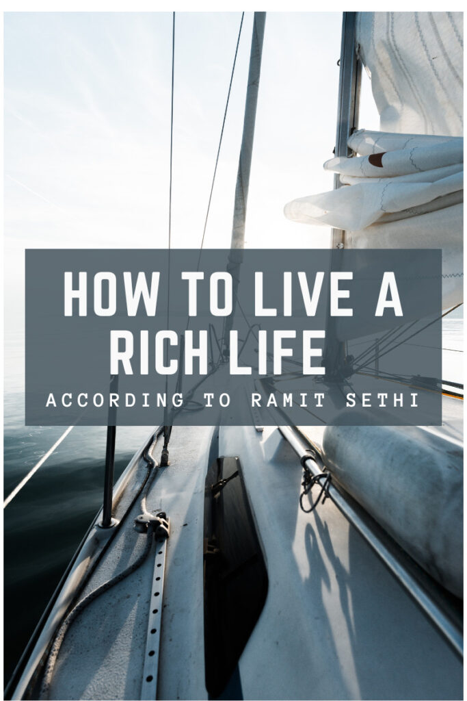 A sail boat on the water with a gray text box overlay that says How to Live a Rich Life According to Ramit Sethi.