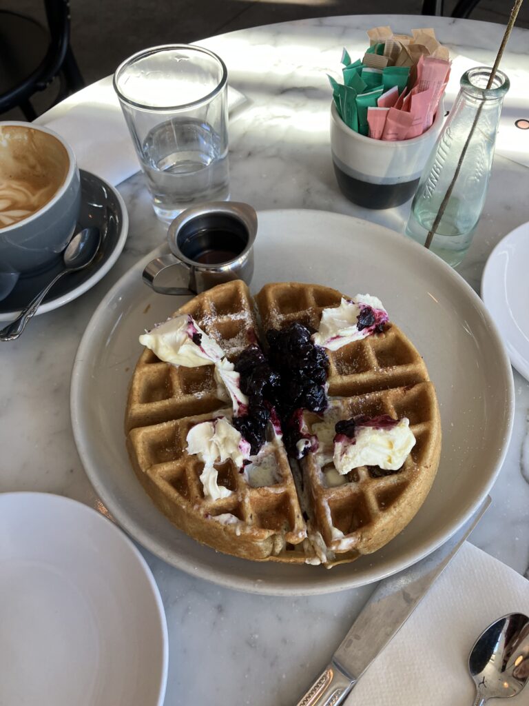 The fluffiest waffle you've ever seen. Topped with fresh mascarpone cheese and blueberry compote at Cafe Roze.