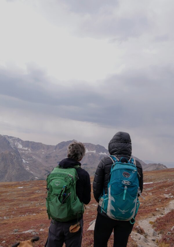 Osprey Fairview backpack on two people on top of a mountain.