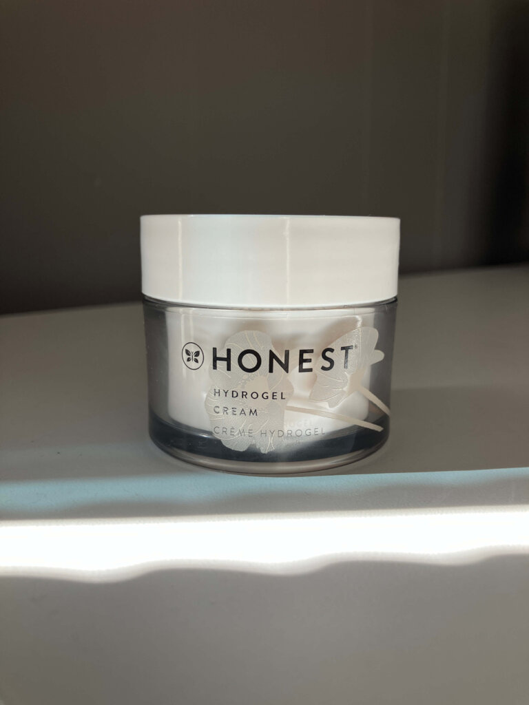 Honest Beauty Hydrogel Cream sitting on a chest of drawers with the sun streaming in. 